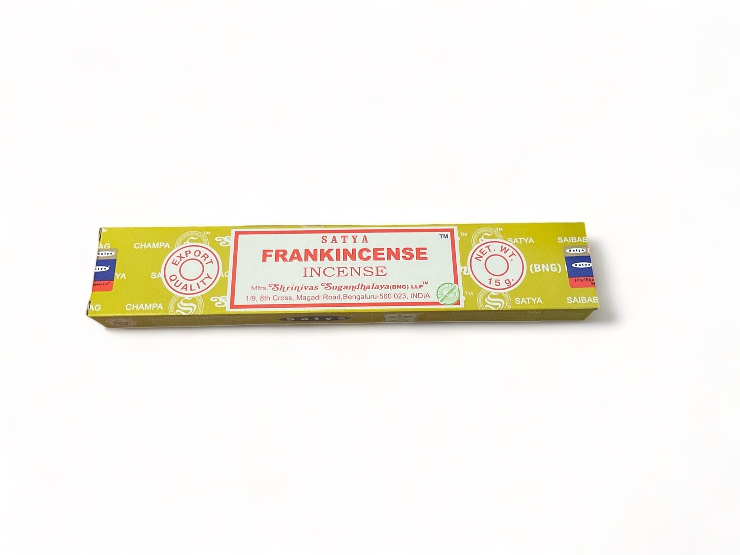 Photograph of a box of 15 Satya Frankincense incense sticks, available at The Crystal Shrine. Each stick is hand-rolled in India. The box features a label indicating that the incense is made from pure extracts and fine oils. The fragrance is described as sweet and earthy, designed to be long-lasting. The packaging is compact and includes details about the product&#39;s high-quality ingredients and its origin.