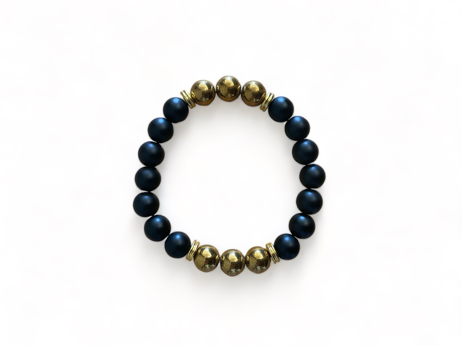Photo of a Power Bracelet featuring 10mm matte black agate beads and gold balls. Designed to offer protection, grounding, and enhance positive thinking and spiritual inspiration. 