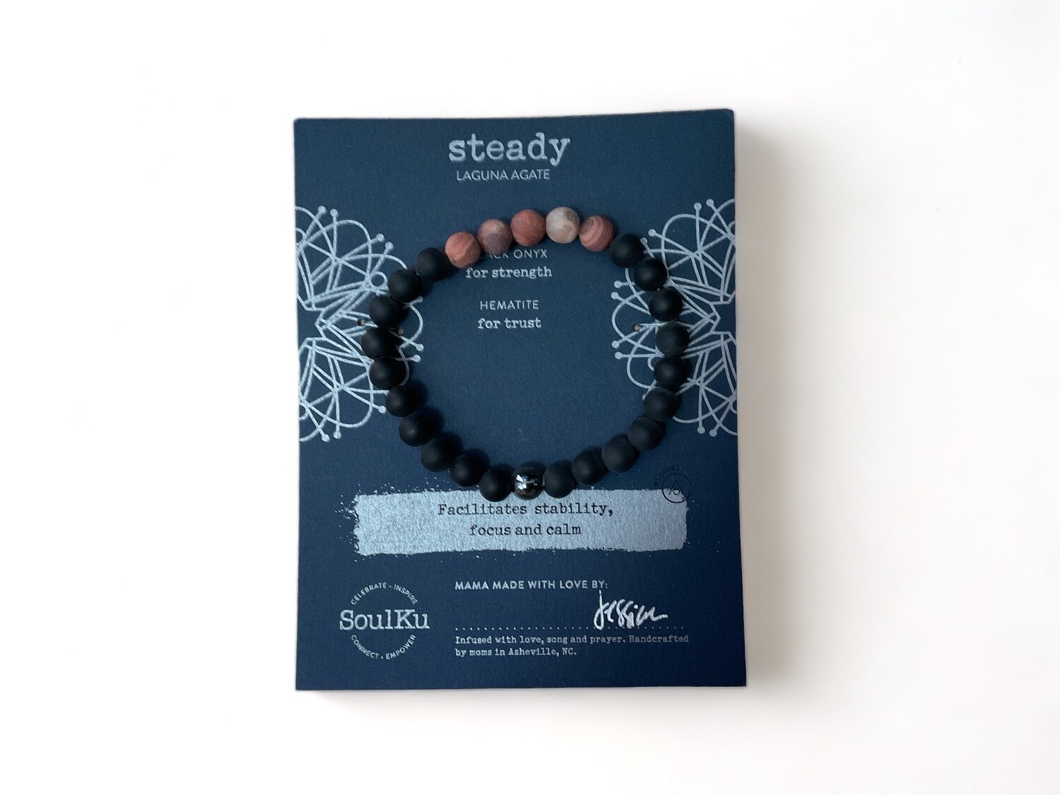 Photo of a Men&#39;s bracelet featuring 8mm beads of Laguna Agate, Black Onyx, and Hematite. This beautiful design combines these mineral stones to support focus, strength, stability, and calm.