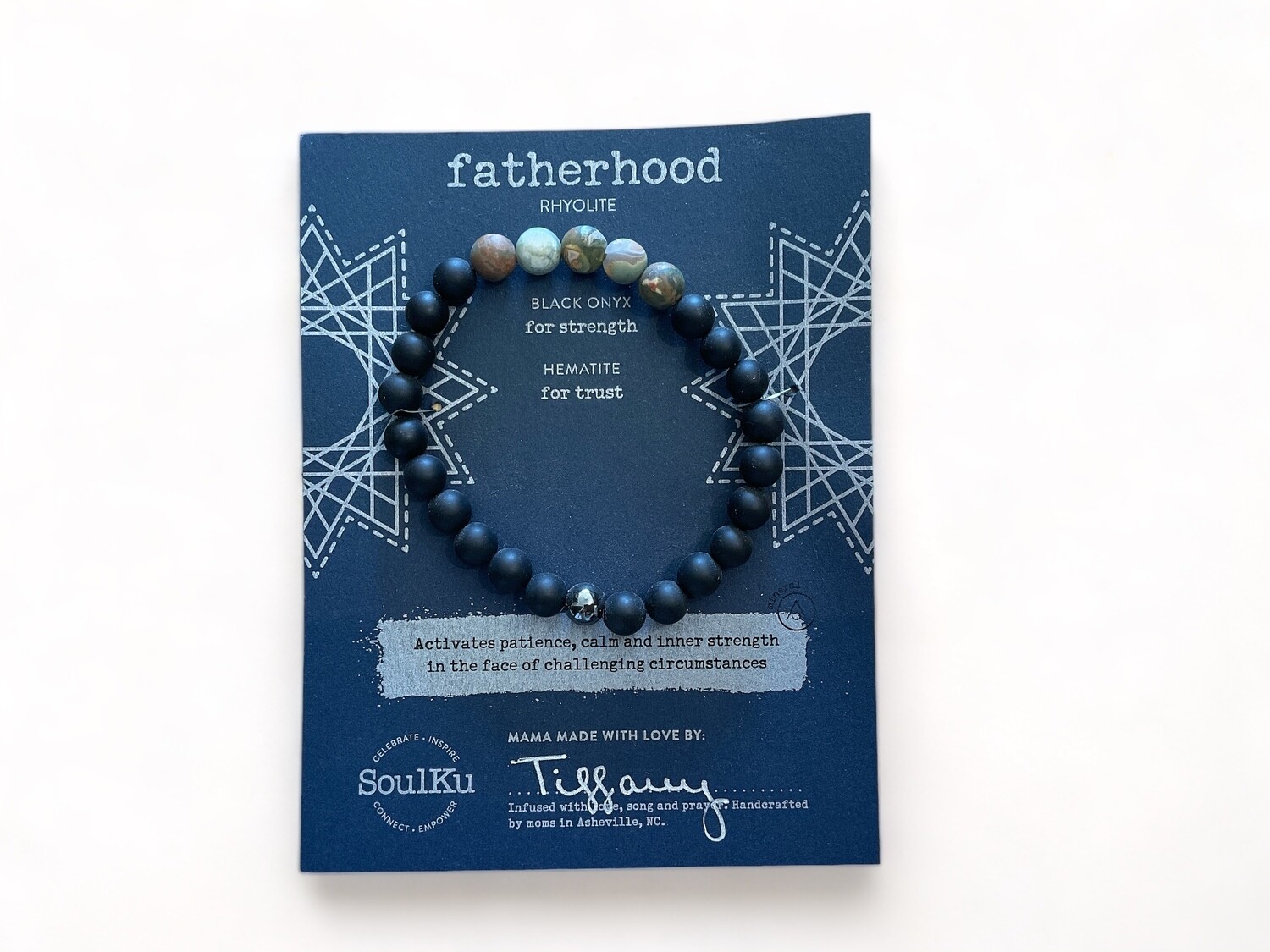 Image of a stunning 8mm Men&#39;s bracelet featuring Rhyolite, Black Onyx, and Hematite beads. Designed to enhance patience, calm, and strength, especially during challenging times.