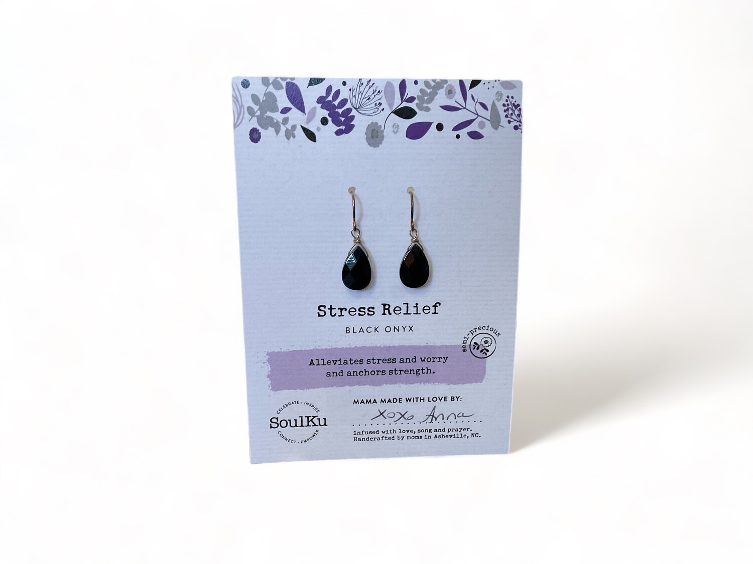 Image of Black Onyx earrings featuring smooth, deep black gemstones set in polished metal hooks. Designed to offer grounding, protection, and support for emotional strength.