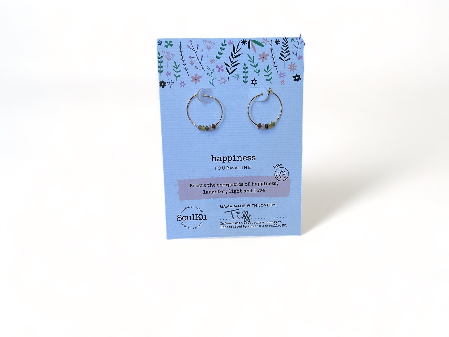 Photo of gold hoop earrings featuring vibrant rainbow tourmaline crystals. The earrings display a spectrum of pink, green, and blue hues, adding a colorful and harmonious touch.