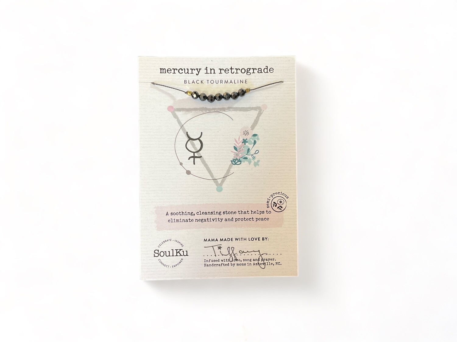 Photo of a Black Tourmaline Mercury in Retrograde Necklace featuring a smooth, stylish jet-black crystals. This necklace is designed to help cleanse negativity and protect your inner peace. 