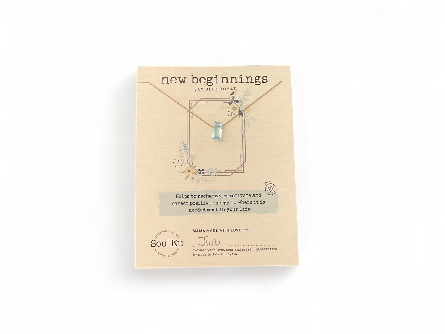 Photo of a Faceted Blue Topaz Necklace featuring a vibrant sky-blue gemstone with multiple facets that reflect light. The necklace&#39;s brilliant color and sparkle are designed to enhance communication, balance, and new beginnings.