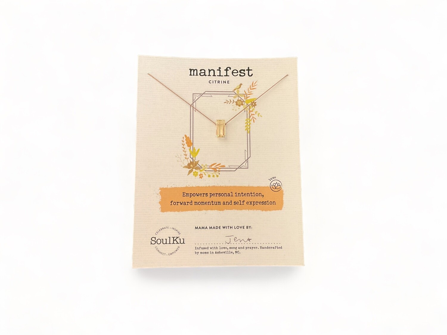 Photograph of a faceted citrine necklace featuring a vibrant, golden-yellow gemstone that captures light with its sparkling brilliance. This radiant crystal is designed to boost personal intention, enhance self-expression, and support manifesting success and joy.