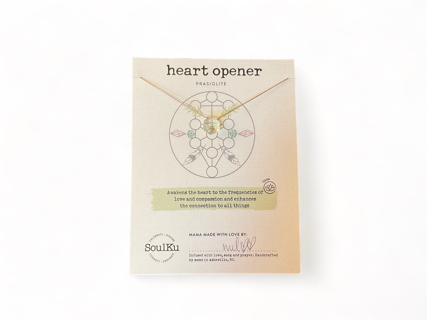 Image of a delicate necklace featuring a prasiolite crystal, a light green stone with a translucent finish, designed to enhance love and compassion