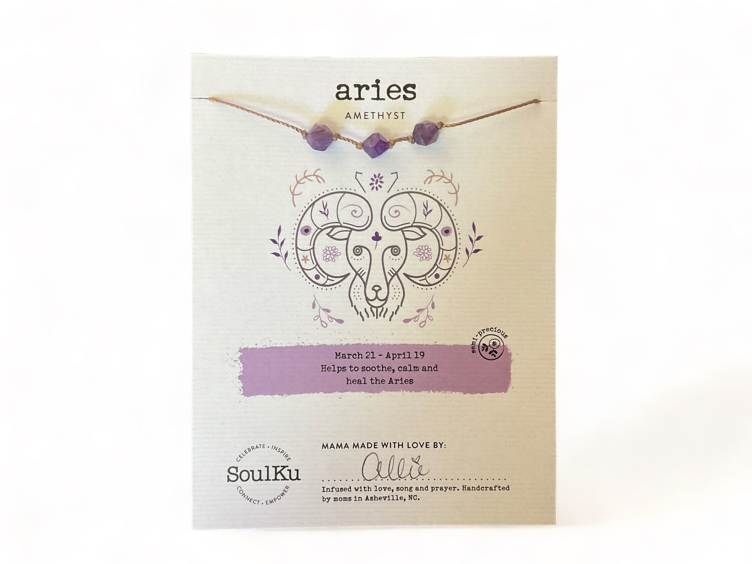 Photograph of an Aries Zodiac Necklace featuring faceted purple Amethyst crystal beads strung on a sturdy nylon cord. The necklace includes a sterling silver clasp and extender, measuring 18 inches in total length, designed to soothe and balance Aries energy.