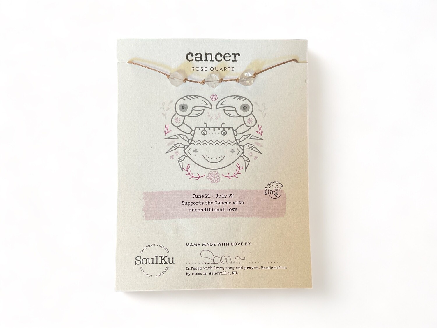 Photo of a Cancer Zodiac Necklace showcasing three shimmering rose quartz crystals. This necklace is designed to provide nurturing love and emotional support for Cancer individuals.