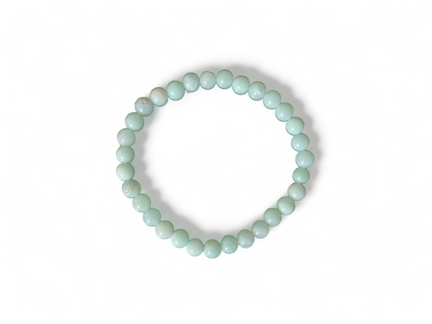Close-up photo of a 6mm Amazonite crystal bracelet, featuring smooth green-blue beads. This bracelet is designed to enhance communication, emotional balance, and manifestation.