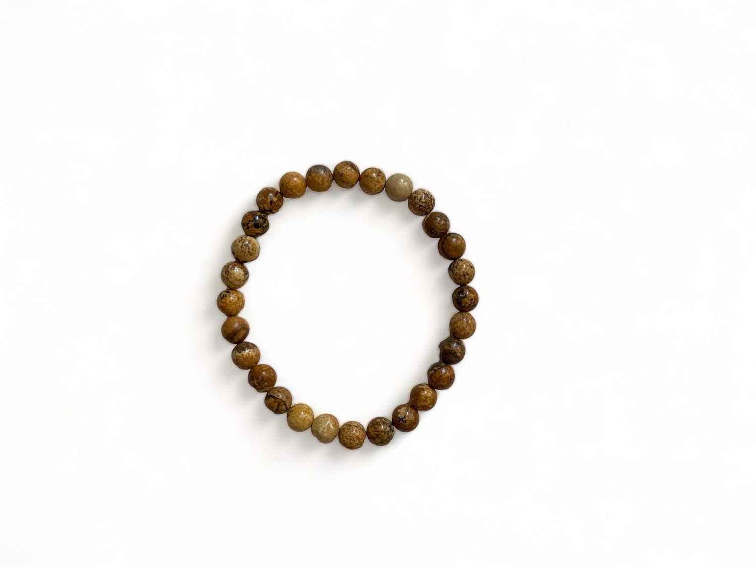 Image of a 6mm Picture Jasper gemstone bracelet featuring earthy brown and tan patterns. This spiritual bracelet is known for its grounding properties and connection to nature and makes for a thoughtful gift.