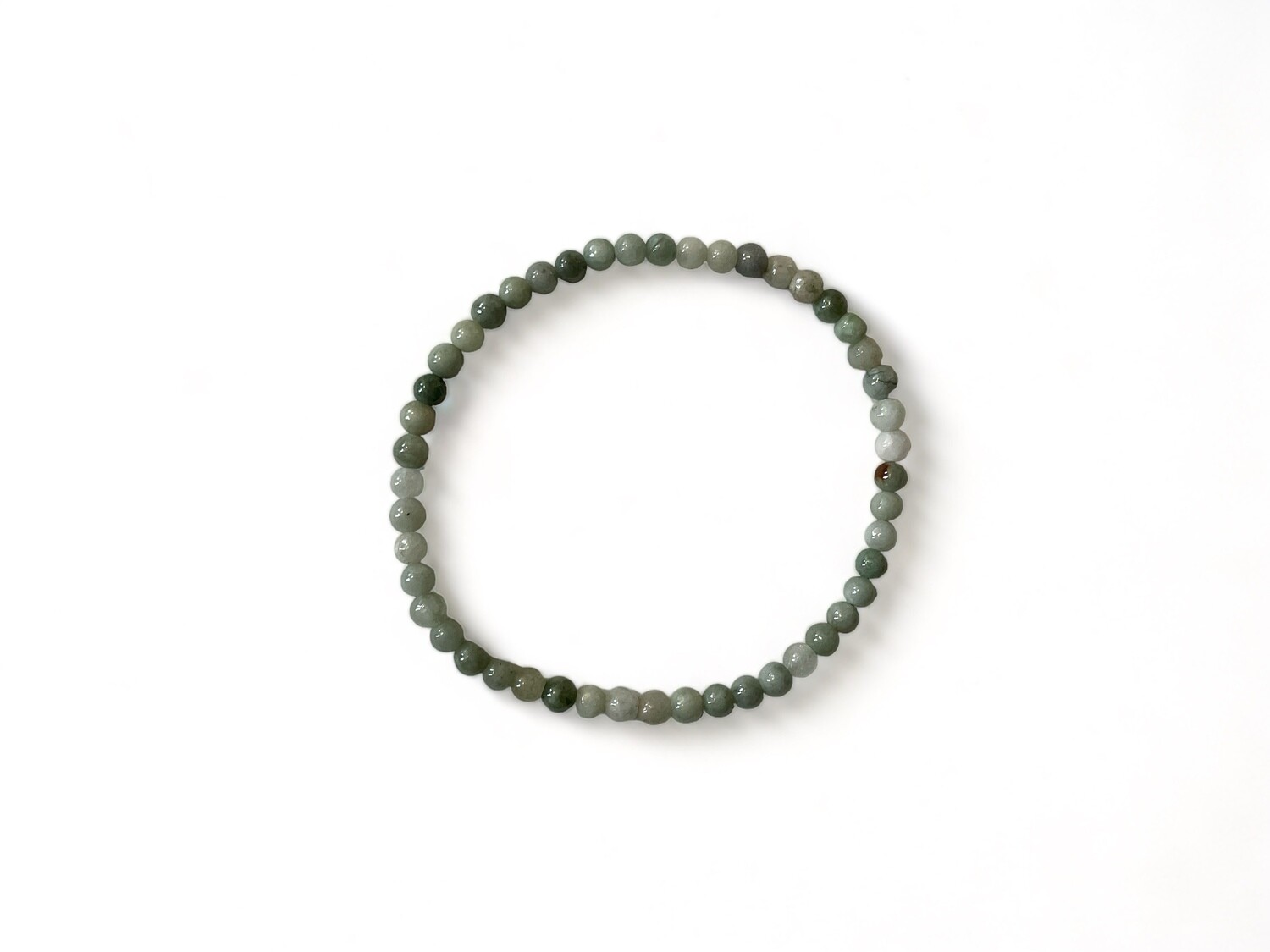 Image of the Premiere Mini Jadeite Bracelet, showcasing vibrant green jadeite beads. This stylish, durable bracelet is designed to promote balance, harmony, and abundance.