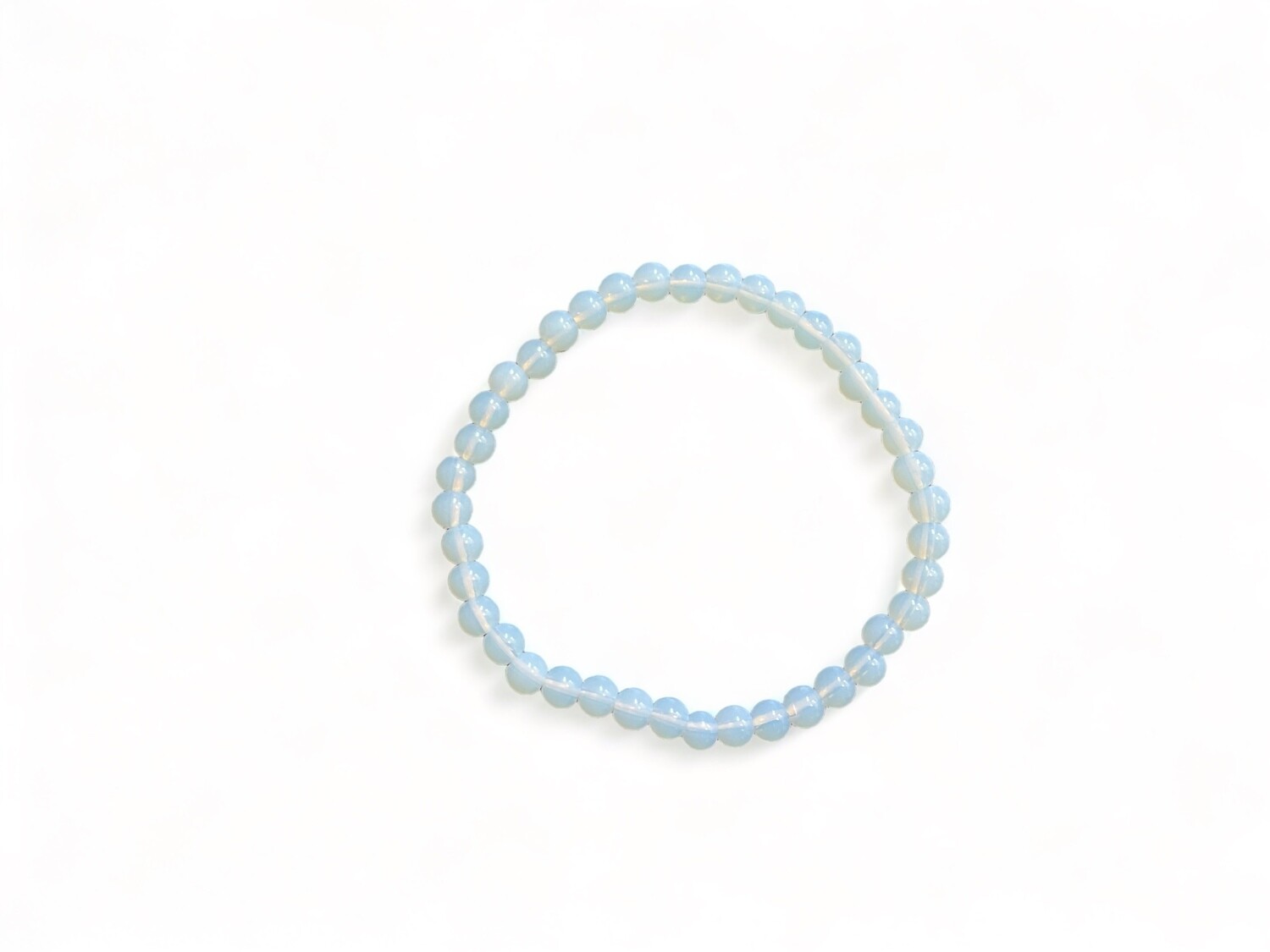 Photo of a 6mm Opalite bracelet with a milky, iridescent glow, ideal for spiritual and healing practices. Features smooth, round beads strung on an elastic band.