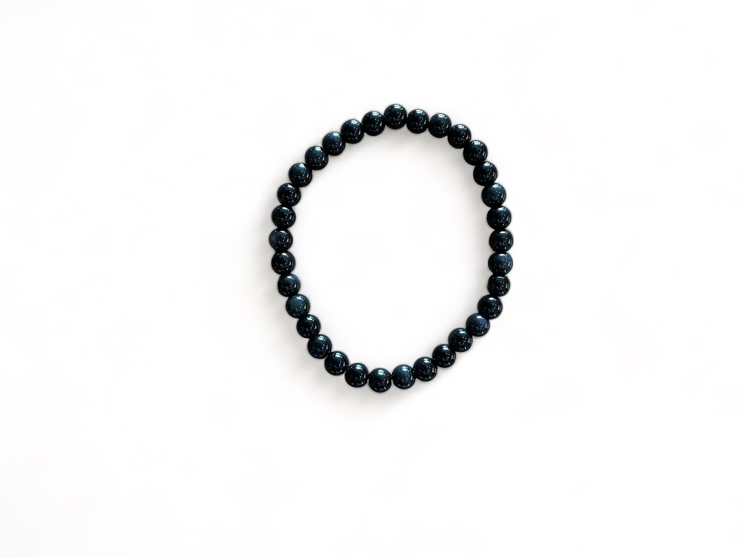 Image of the 6mm Black Obsidian Power Six Premiere Bracelet, featuring smooth, glossy black beads. This sleek volcanic glass bracelet is designed for protection, grounding, manifestation and emotional healing.