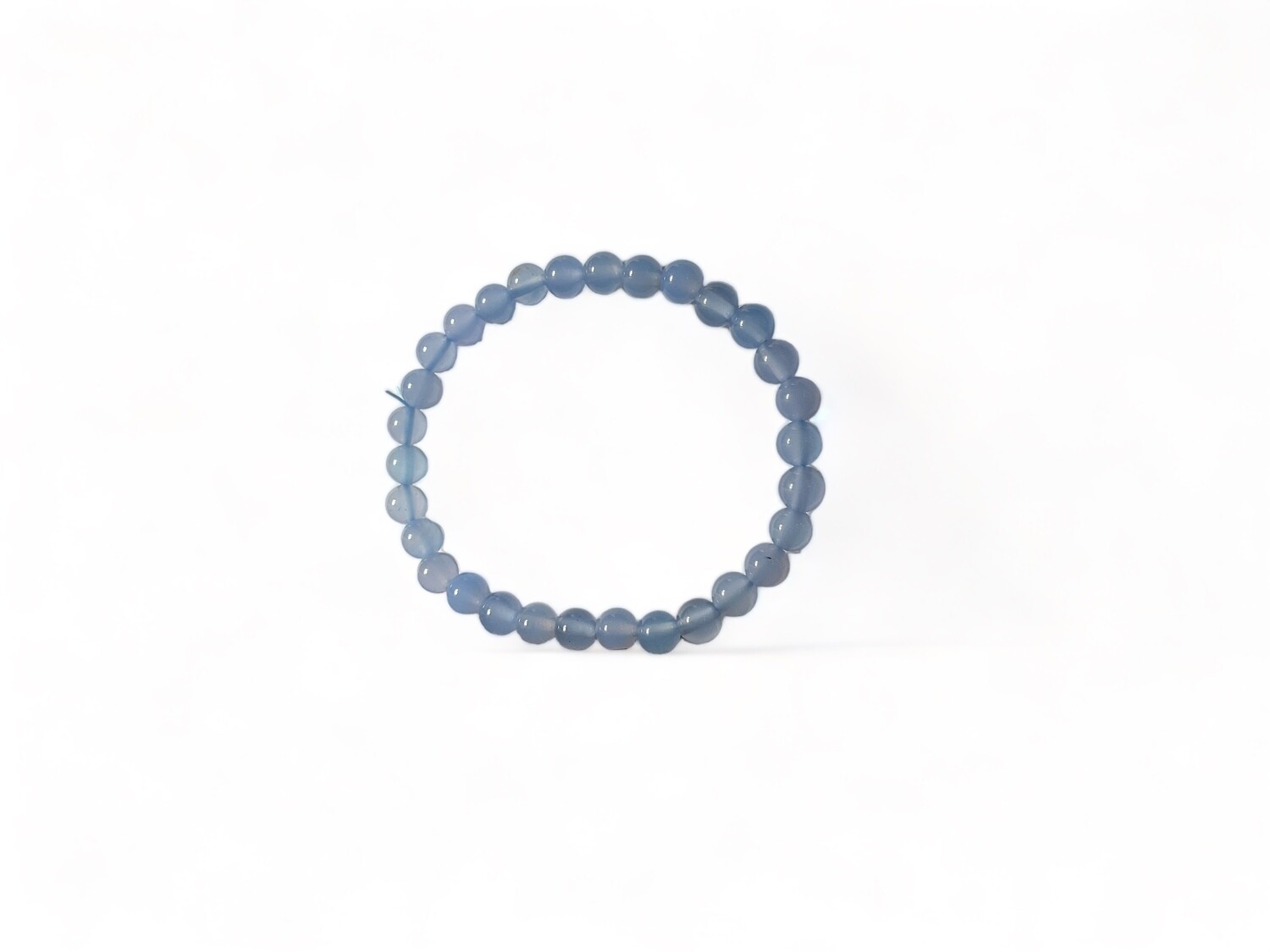 Photo of a 6mm Blue Chalcedony bracelet featuring soft blue beads with a smooth finish. This bracelet is valued for its calming effects and spiritual benefits.