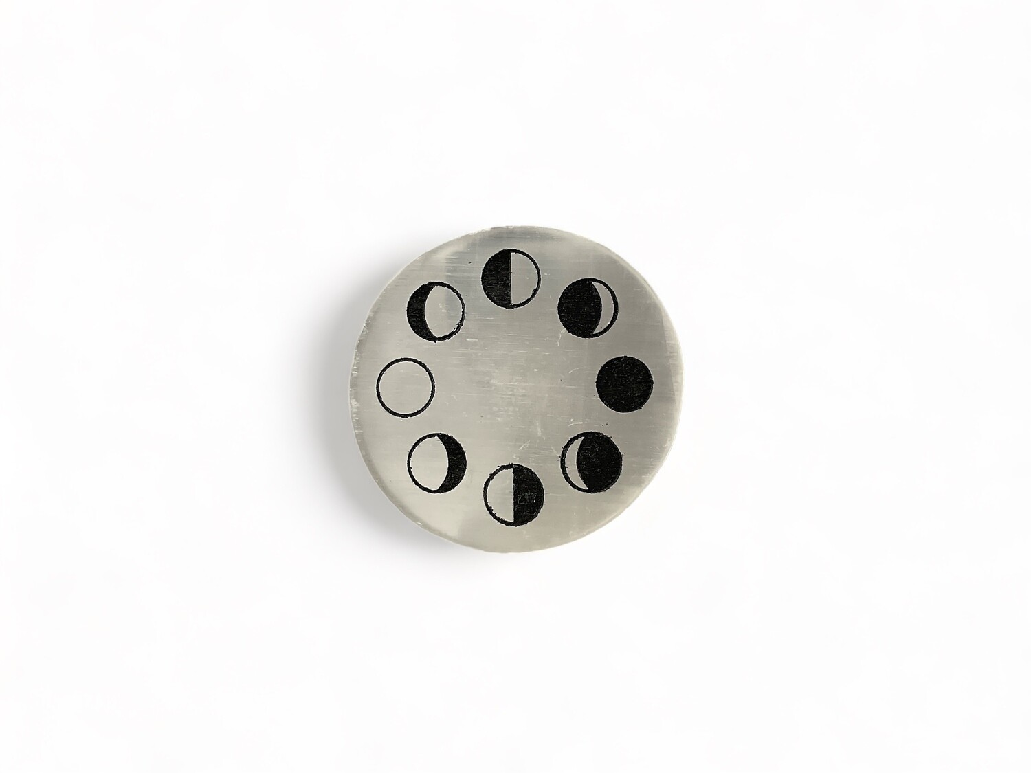 Photo of a 3&quot; Selenite Moon Phase Coaster – Adds a touch of elegance and protects surfaces with its spiritual design. Perfect for enhancing any environment.