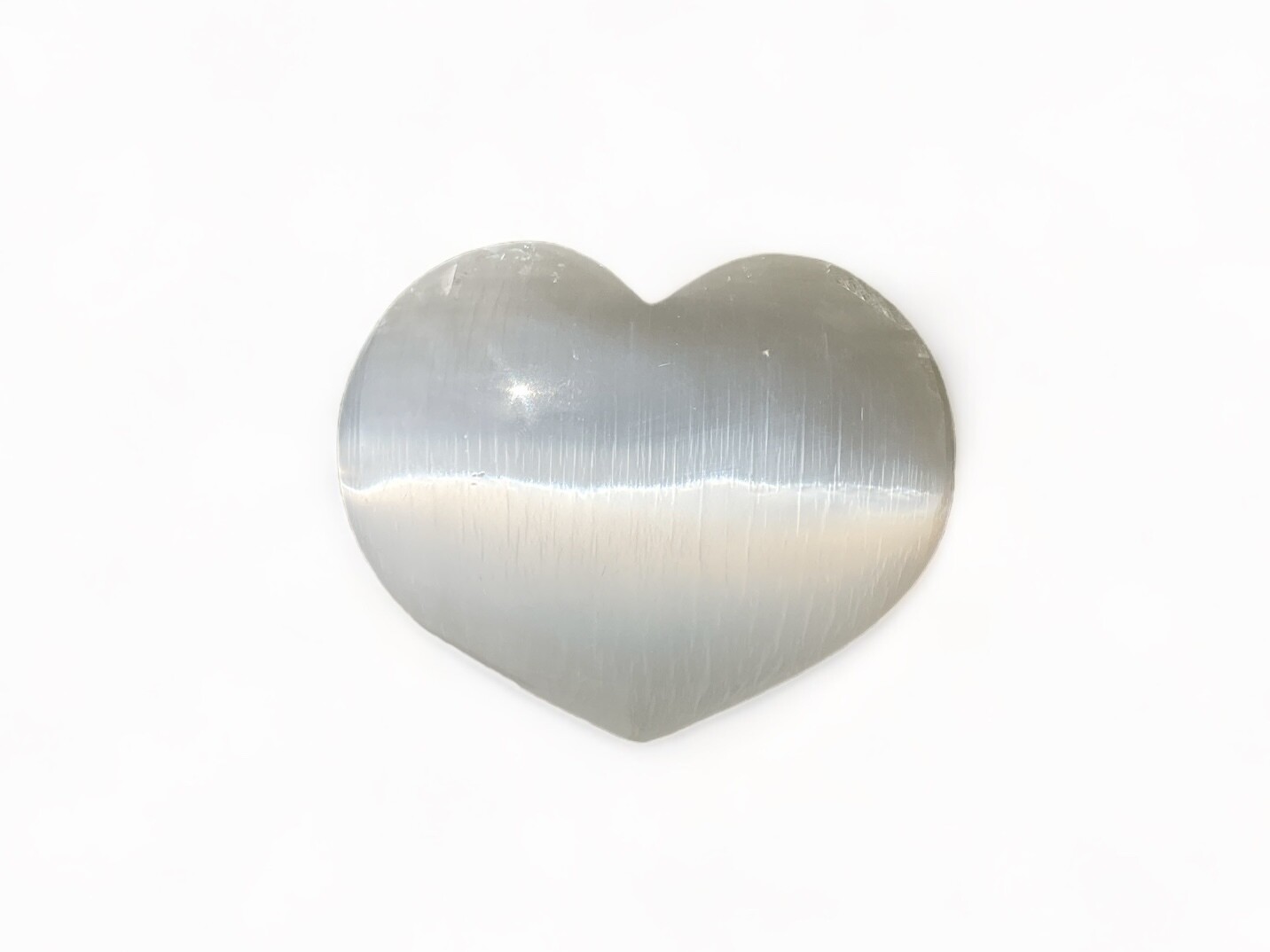 Photo of a 5-inch Selenite Heart designed to aid in healing and emotional balance. Ideal for meditation and spiritual growth, showcasing its unique, rare crystal properties.