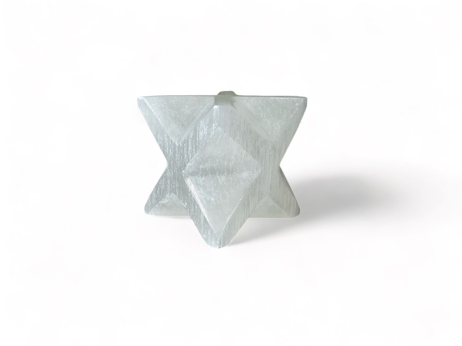 Image of a 2.25-inch Selenite Merkaba, ideal for energy work and spiritual growth. Perfect for crystal collectors and enthusiasts, featuring intricate, rare craftsmanship.