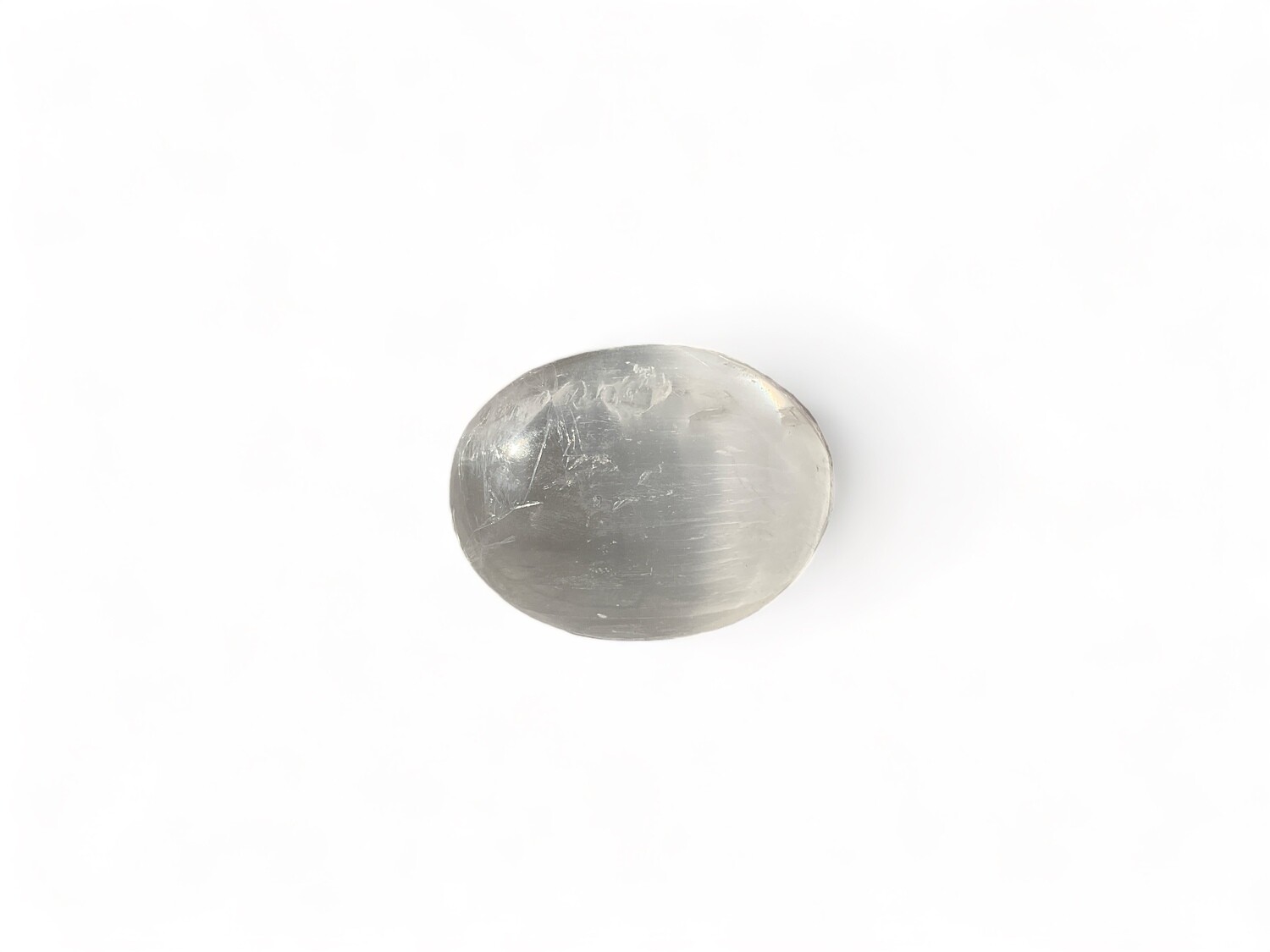 Image of a Selenite palm stone for energy cleansing and chakra balancing. Perfect for meditation, healing, and spiritual growth. Disclaimer: Stone color, size, or shape may slightly vary from image. Each order is randomly chosen by The Crystal Shrine staff.
