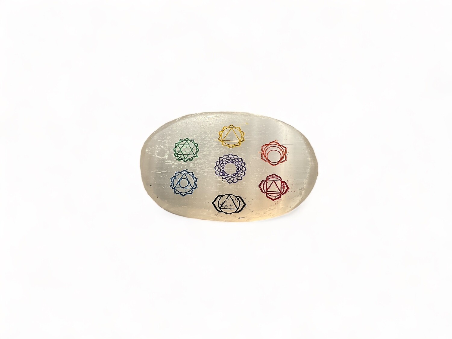 Photo of a Selenite palm stone featuring a 7 chakra design, known for its soothing and energizing properties. Ideal for helping balance energy and enhancing spiritual practices. Disclaimer: Stone color, size, or shape may slightly vary from image. Each order is randomly chosen by The Crystal Shrine staff.