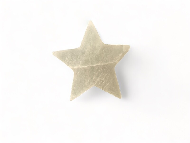 Photo of 2.5” Selenite star shaped crystal, ideal for energy healing and spiritual balancing. Disclaimer: Stone color, size, or shape may slightly vary from image. Each order is randomly chosen by The Crystal Shrine staff.