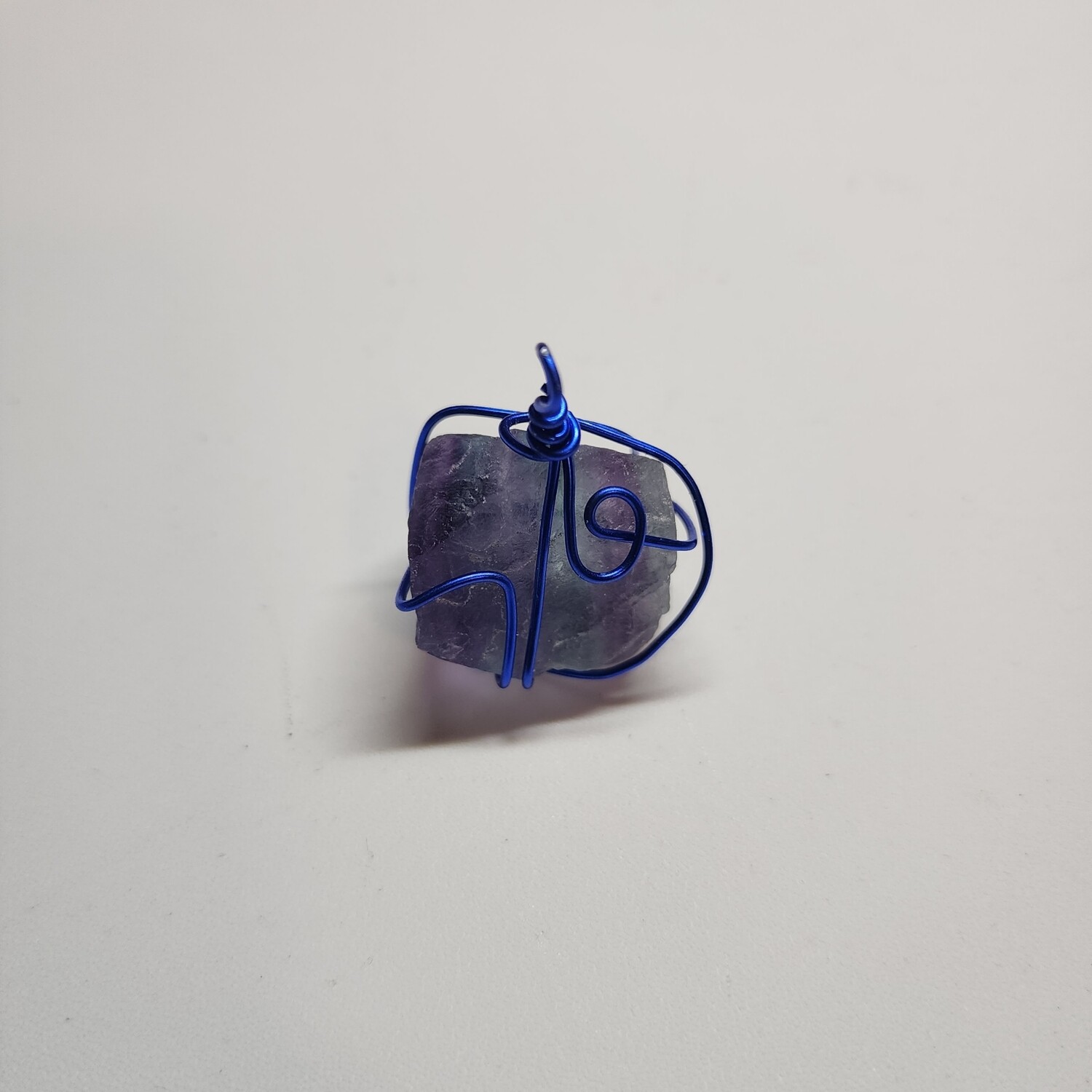 Fluorite wrapped in blue coated wire