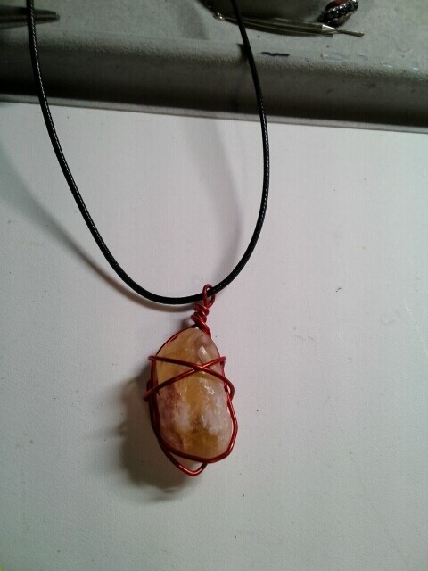 Citrine stone rough wrapped in red wire