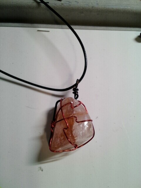 Fire quartz wrapped in red wire 