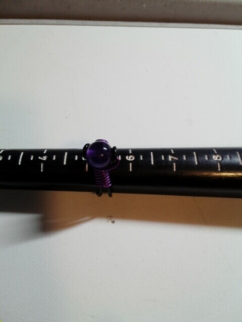 Amethyst ring on black wire