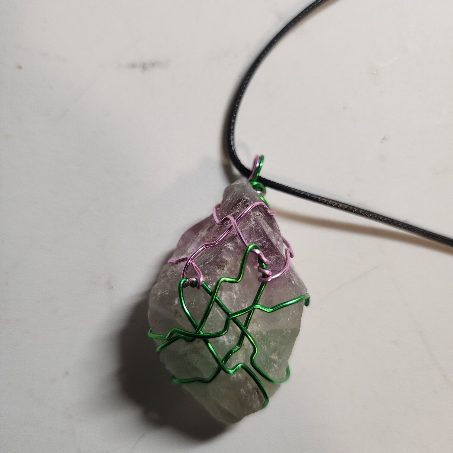 Fluorite wrapped in green and pink wire