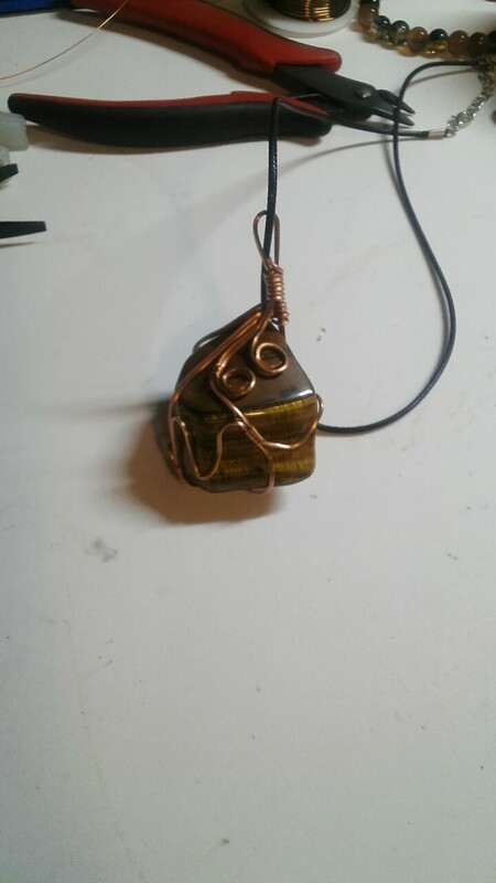 Tiger&#39;s eye stone wrapped in copper wire
