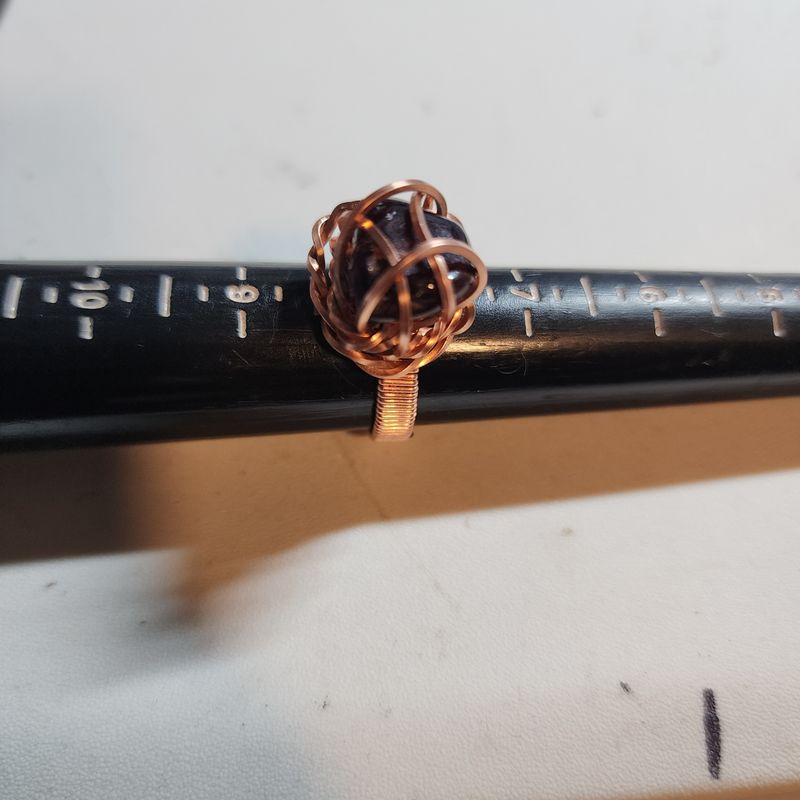Red garnet ring in copper wire