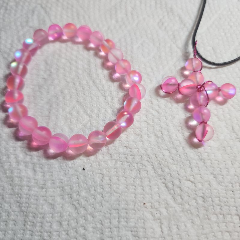 Pink cat eye cross and bracelet