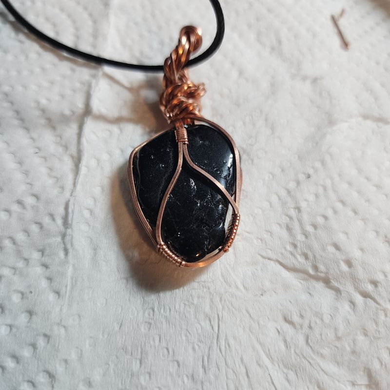 Black tourmaline wrapped in copper wire