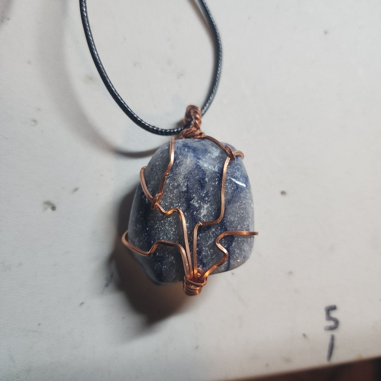 Blue aventurine wrapped in copper wire