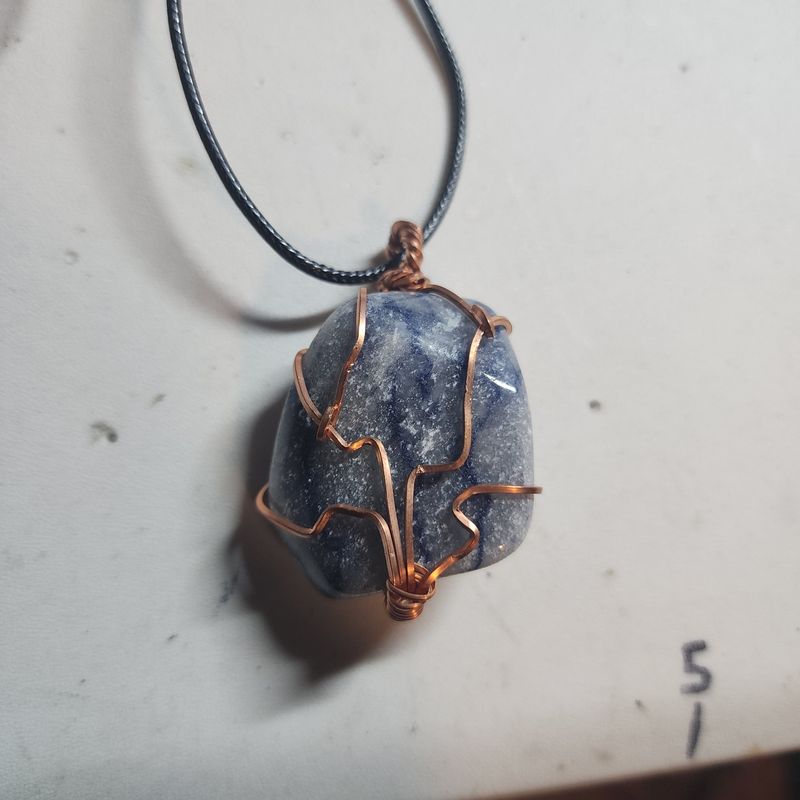 Blue aventurine wrapped in copper wire