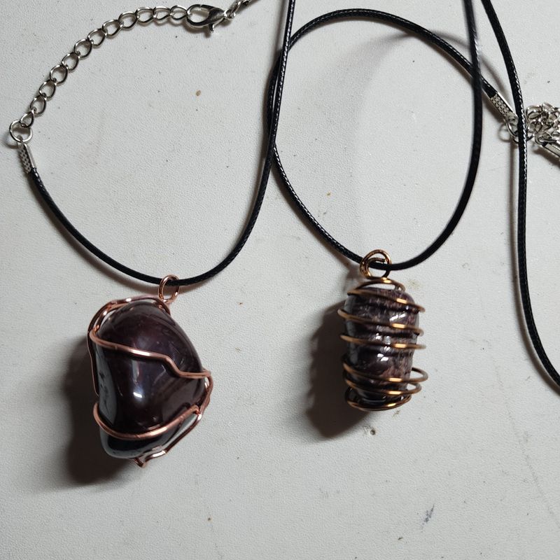 Red garnet stone wrapped in copper wire