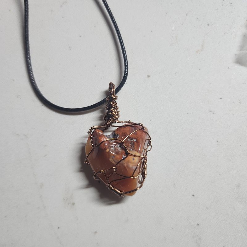 Heart shaped carnelian crystal wrapped in copper wire