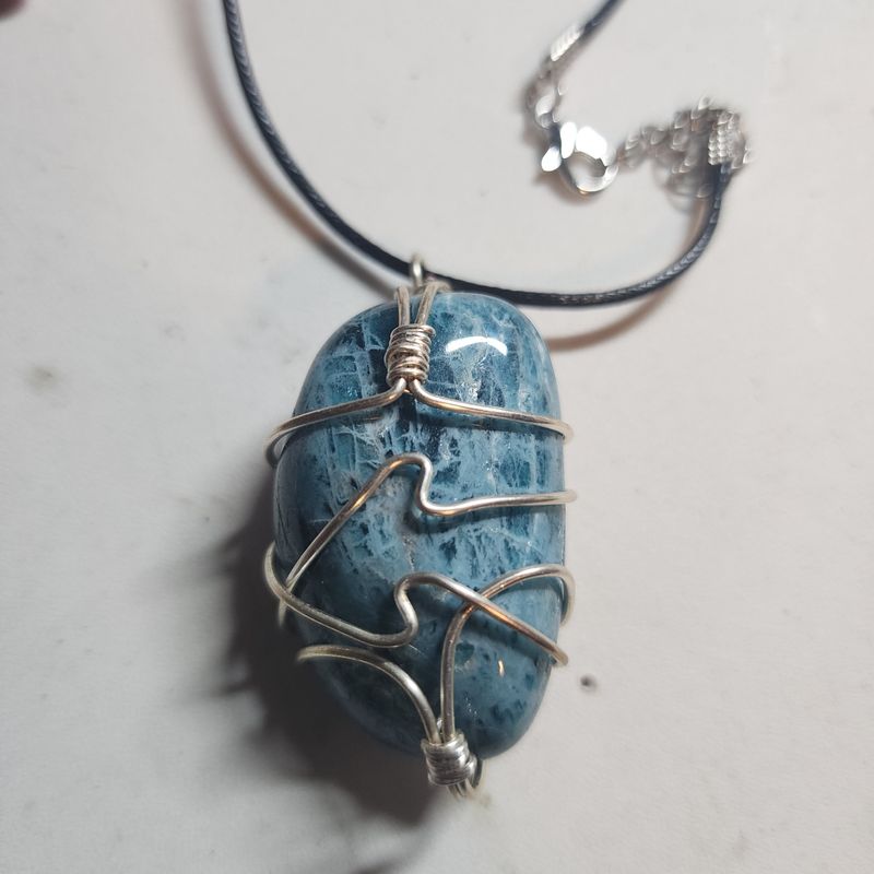Blue apatite crystal wrapped in silver wire