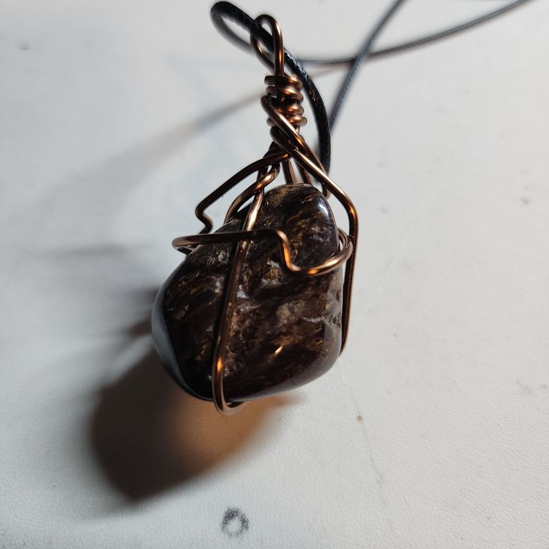 Bronzite wrapped stone
