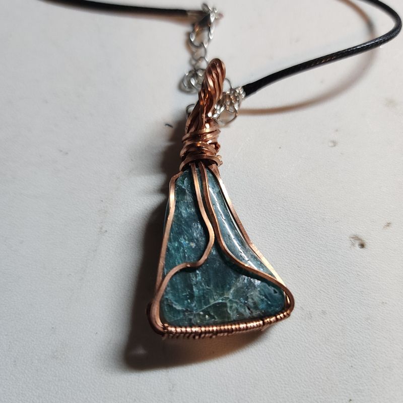 Blue apatite wrapped in copper wire