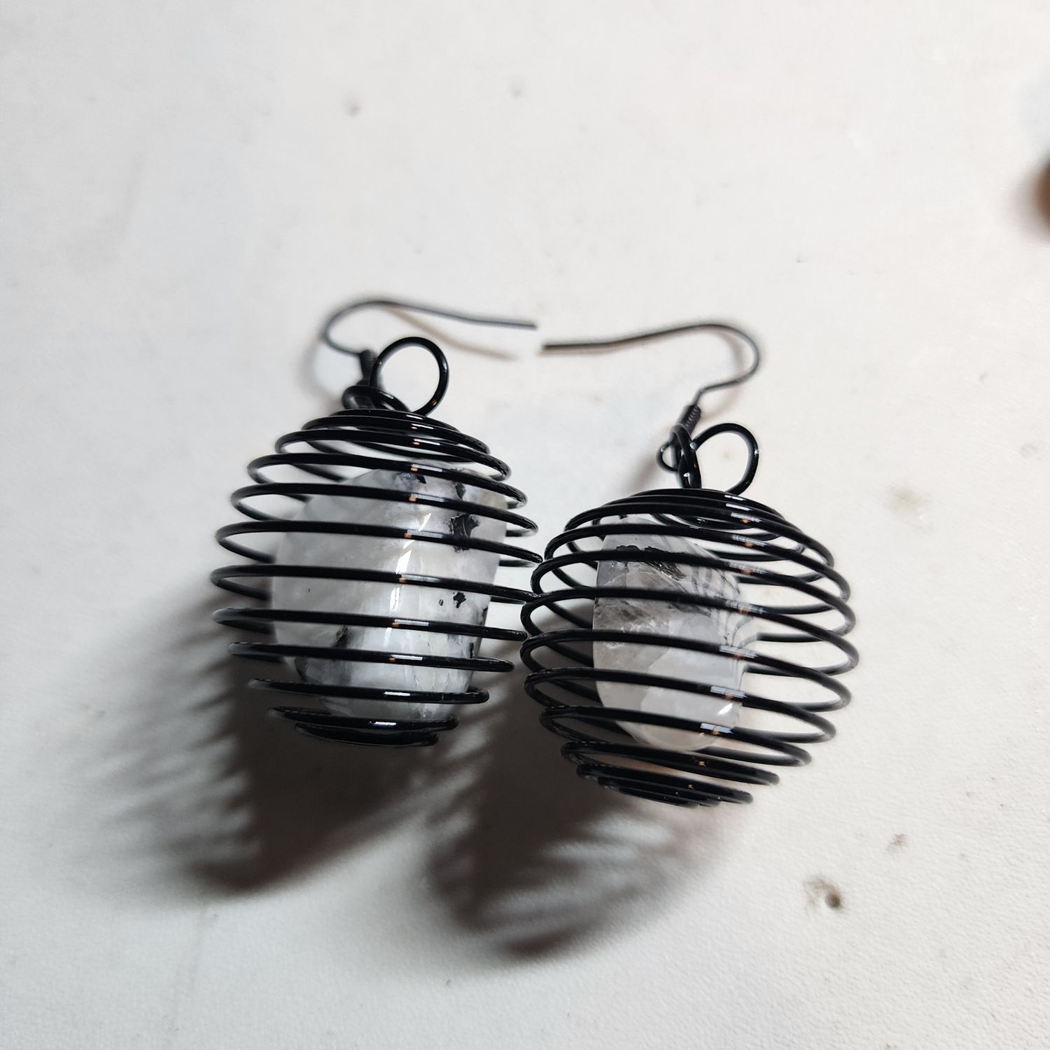 Moonstone crystal earrings in black cage