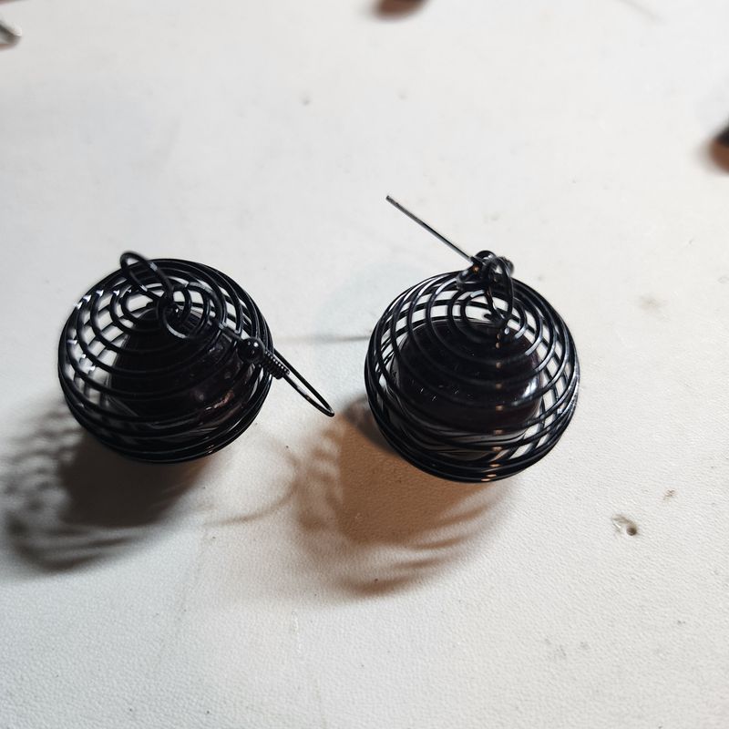 Red garnet earrings in cage
