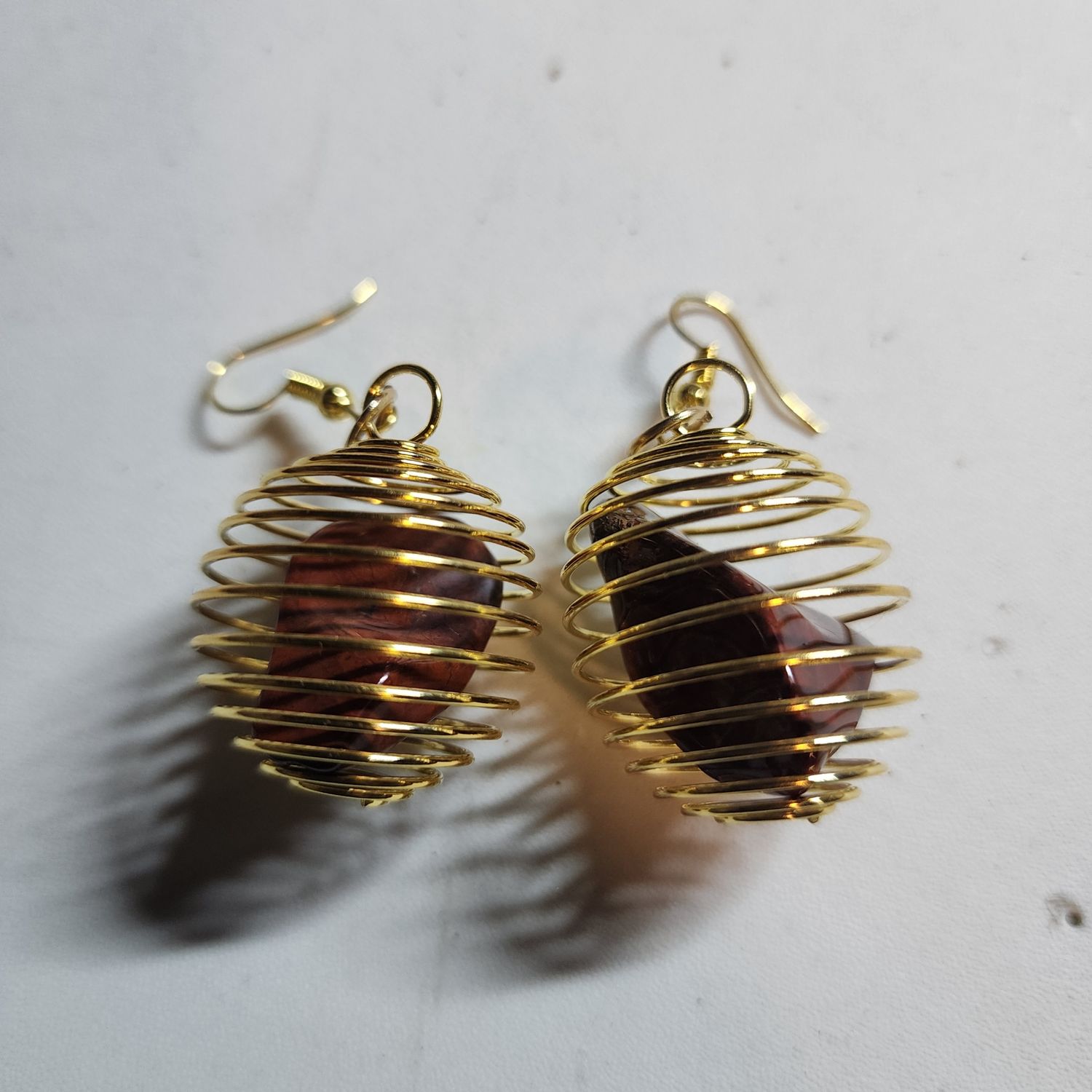 Red jasper stone earrings in gold cage