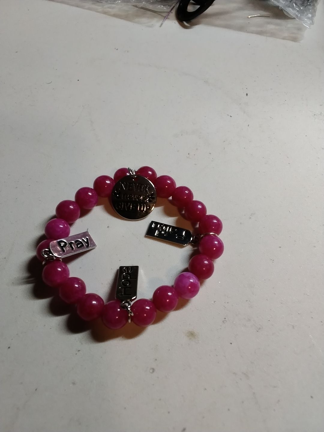 Strawberry jade bracelet with charms