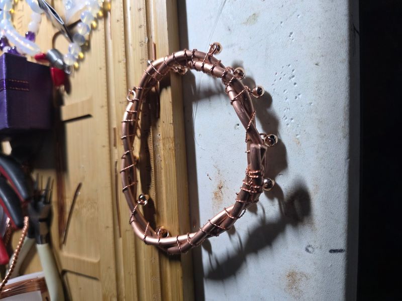 Double twisted copper. Bangle with bells