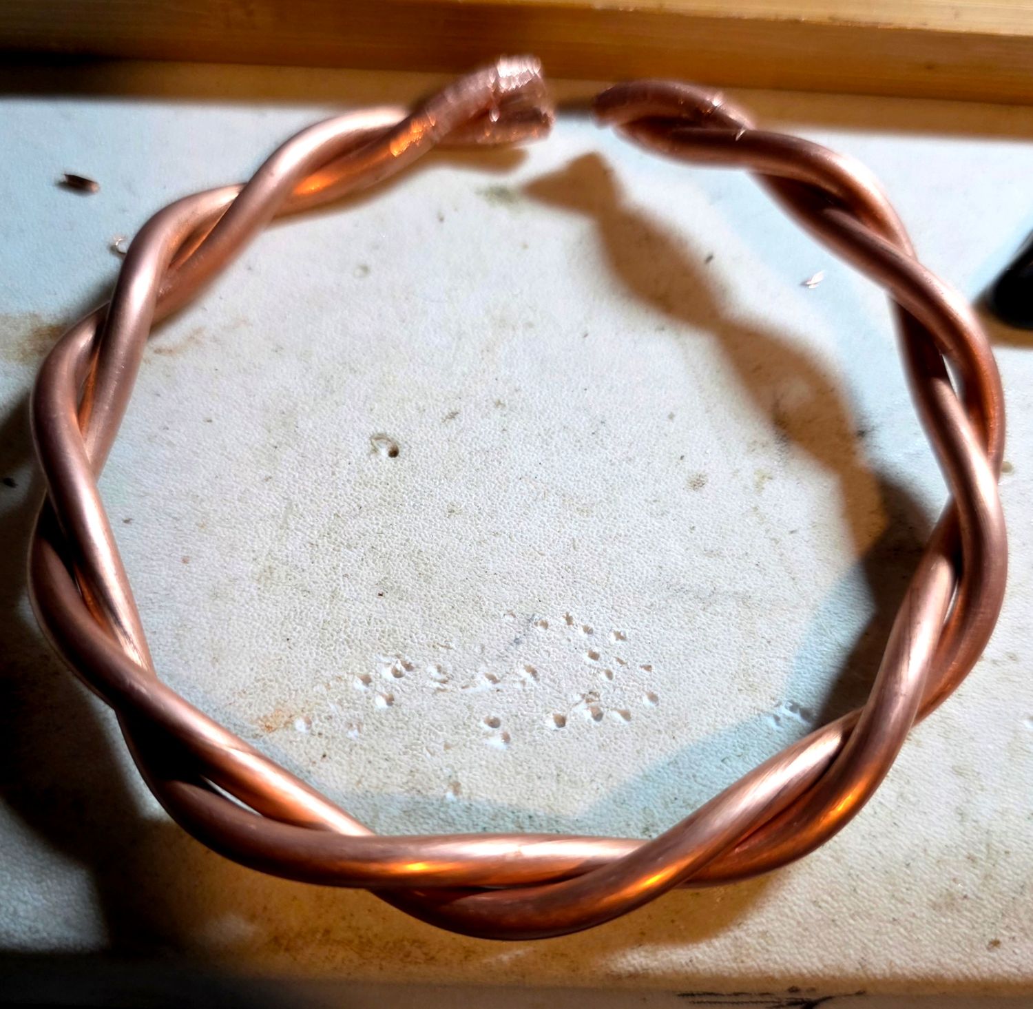 Double twisted copper bangle
