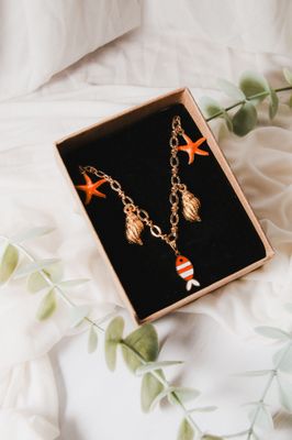 Collier - Poisson orange Bulot Collier - Poisson orange Bulot