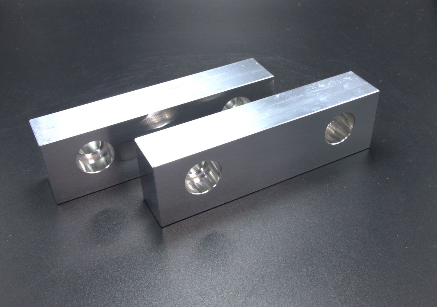 Pair of 4&quot; 6061 aluminum soft jaws. 0.75&quot; Thick, 1.2&quot; tall.