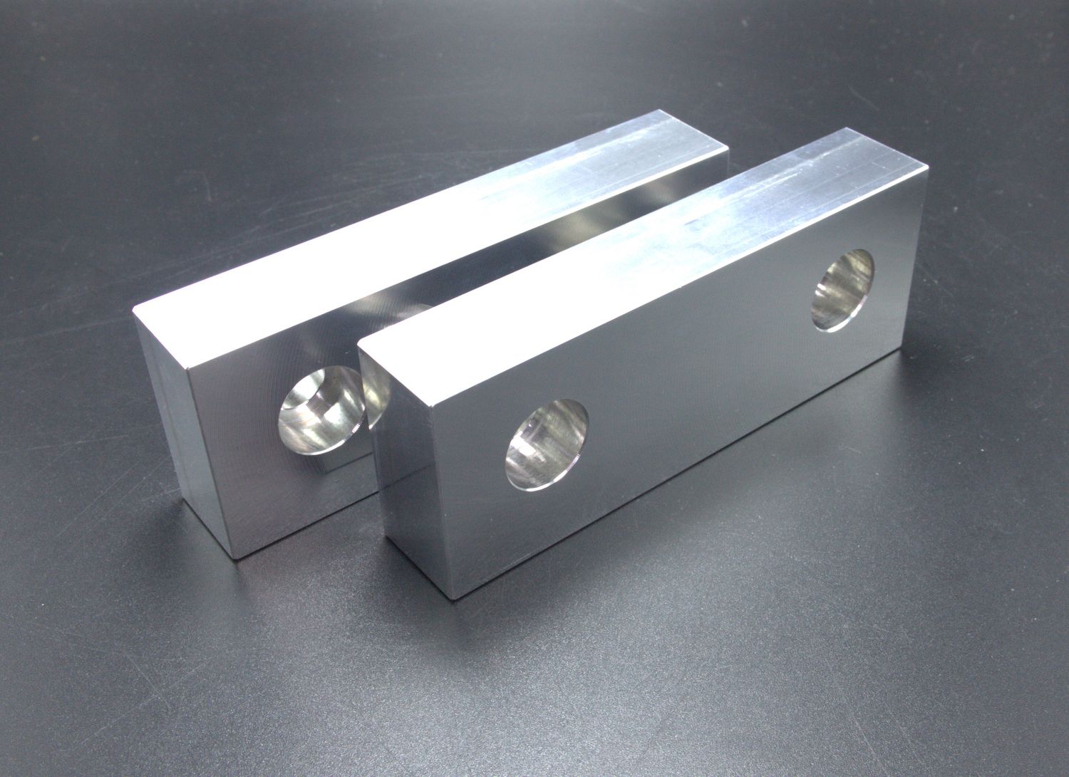 Pair of 4&quot; 6061 aluminum soft jaws. 0.75&quot; Thick, 1.5&quot; tall.