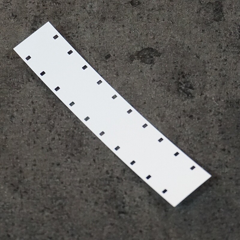 16mm film leader, white, double perforated.